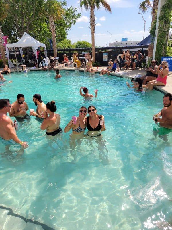 People having fun and drinking in the pool
